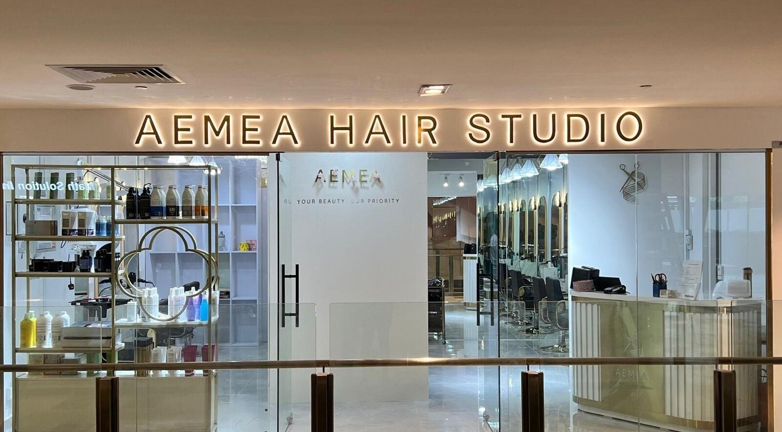 Aemea Hair Studio facade at Admiralty Place, Woodlands, Singapore. Elegant salon interior and welcoming entrance.