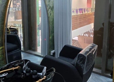 Modern interior of Minna Haircare Studio at Plantation Crescent, Tengah, Singapore, featuring sleek salon chairs.