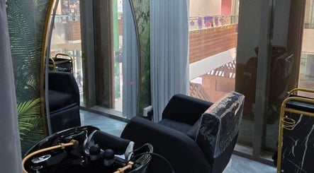 Modern interior of Minna Haircare Studio at Plantation Crescent, Tengah, Singapore, featuring sleek salon chairs.