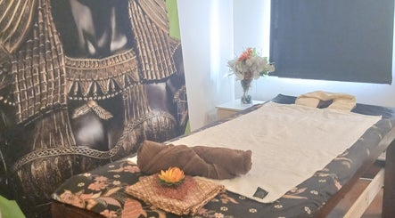 Relaxing massage table setup at MoiThai Spa in Westville, Kwazulu-natal, ZA with elegant decor.