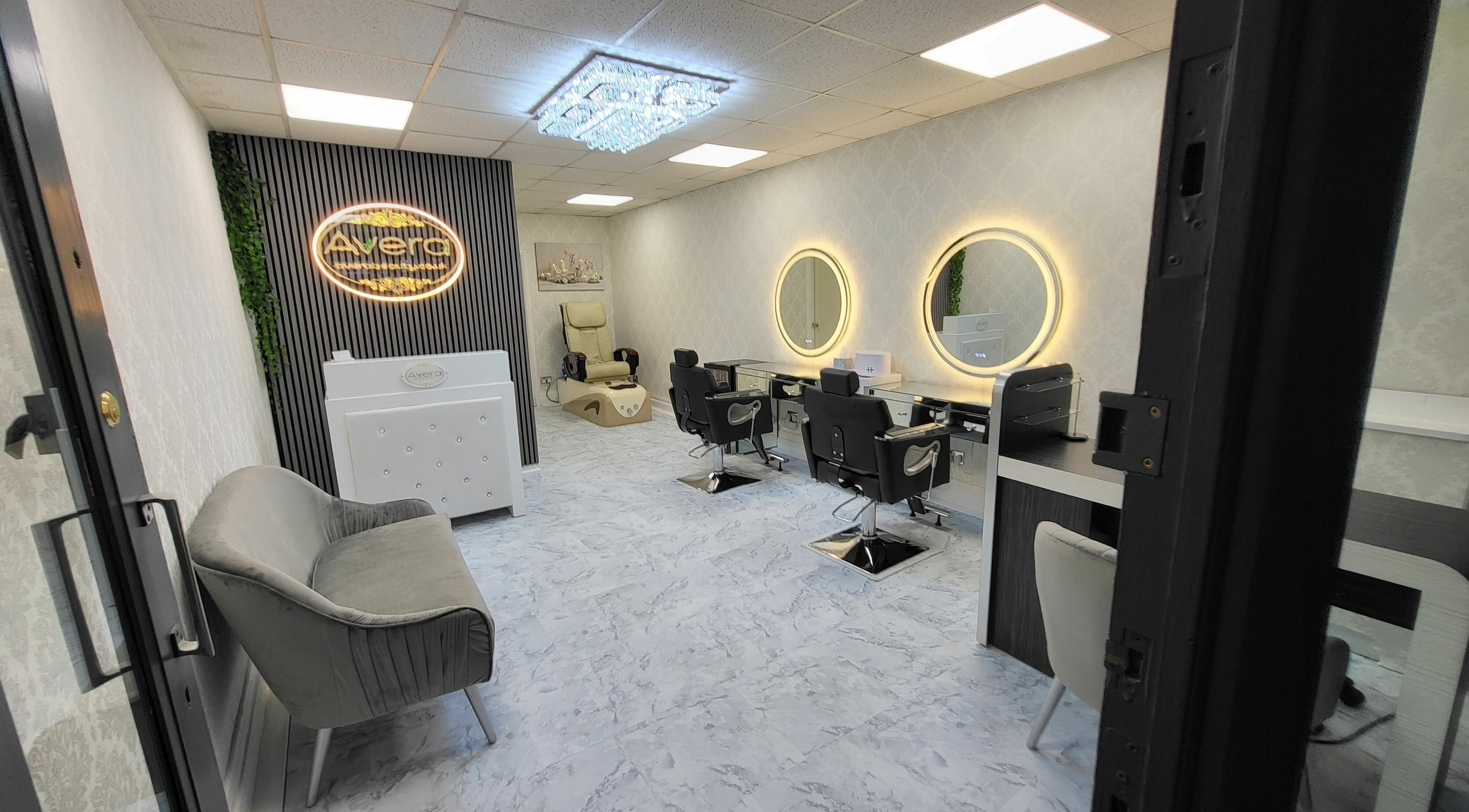 Avera Beauty salon interior in Southend-on-sea, England, GB, featuring stylish seating and mirrored stations.
