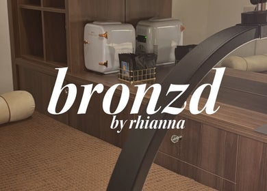 Luxurious spa room at Bronzed Beauty, Bangor, Northern Ireland, GB with plush bedding and modern decor.