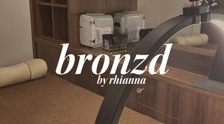 Luxurious spa room at Bronzed Beauty, Bangor, Northern Ireland, GB with plush bedding and modern decor.