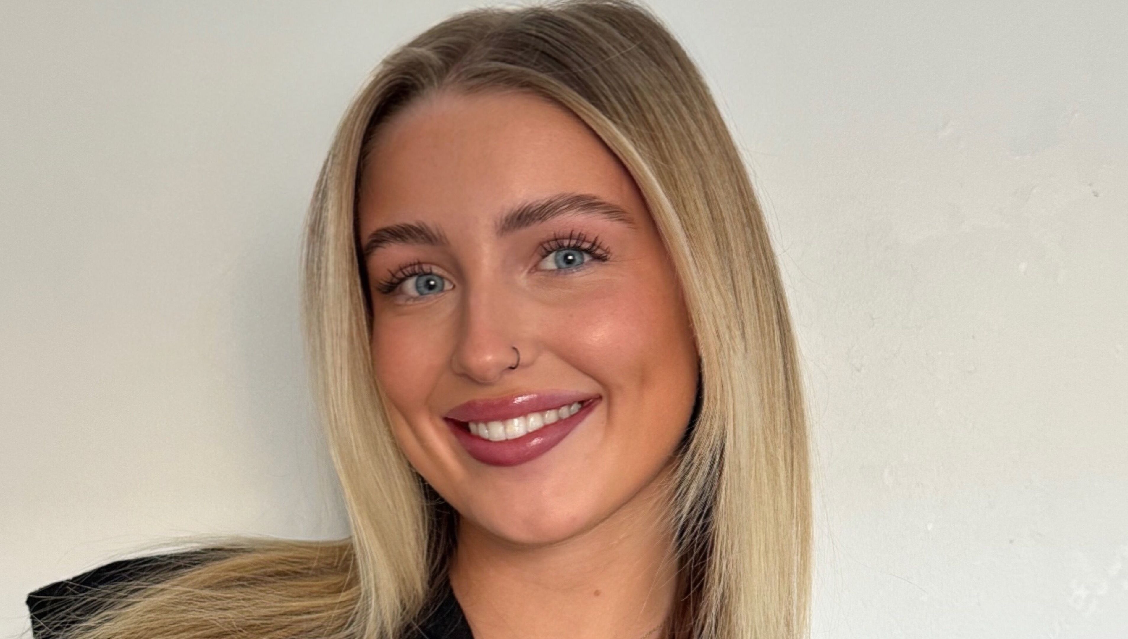 Radiant smile of a person at Refined by Rhianna, Bangor, Northern Ireland, GB.