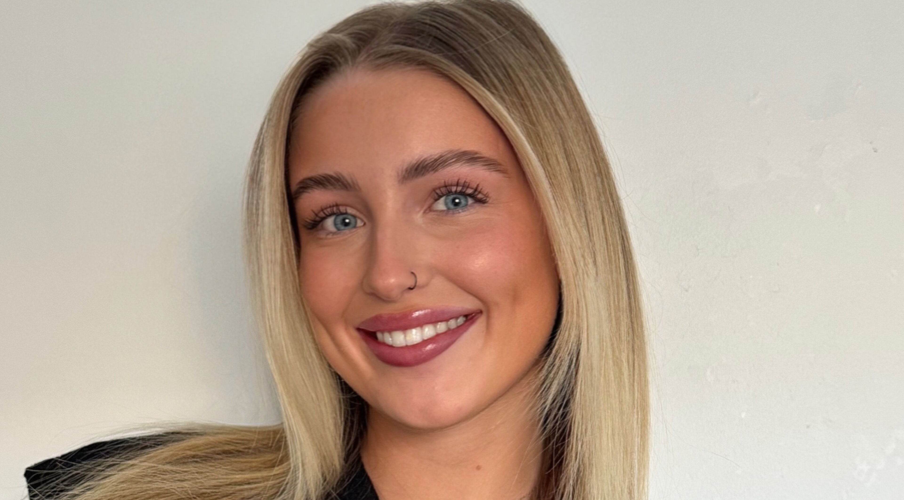 Radiant smile of a person at Refined by Rhianna, Bangor, Northern Ireland, GB.