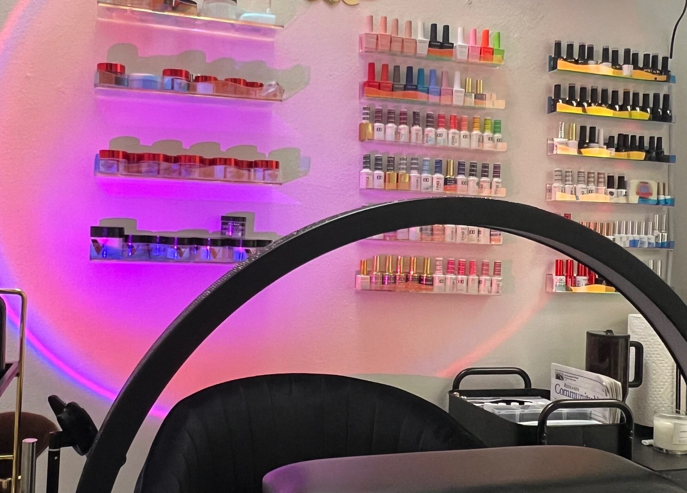 Bright nail polish display at Clawed and Polished in Redlands, California, US, with a cozy ambiance.
