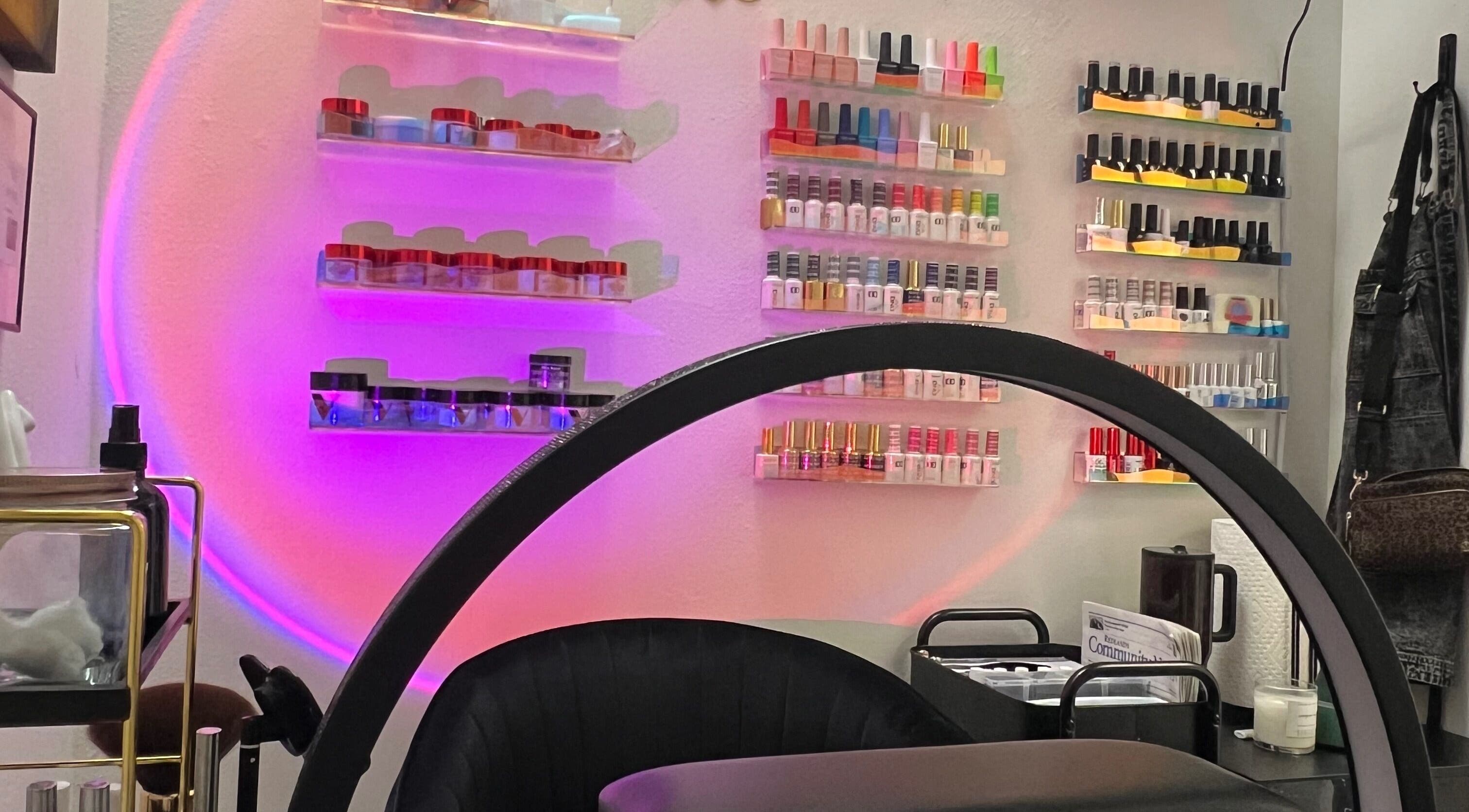 Bright nail polish display at Clawed and Polished in Redlands, California, US, with a cozy ambiance.