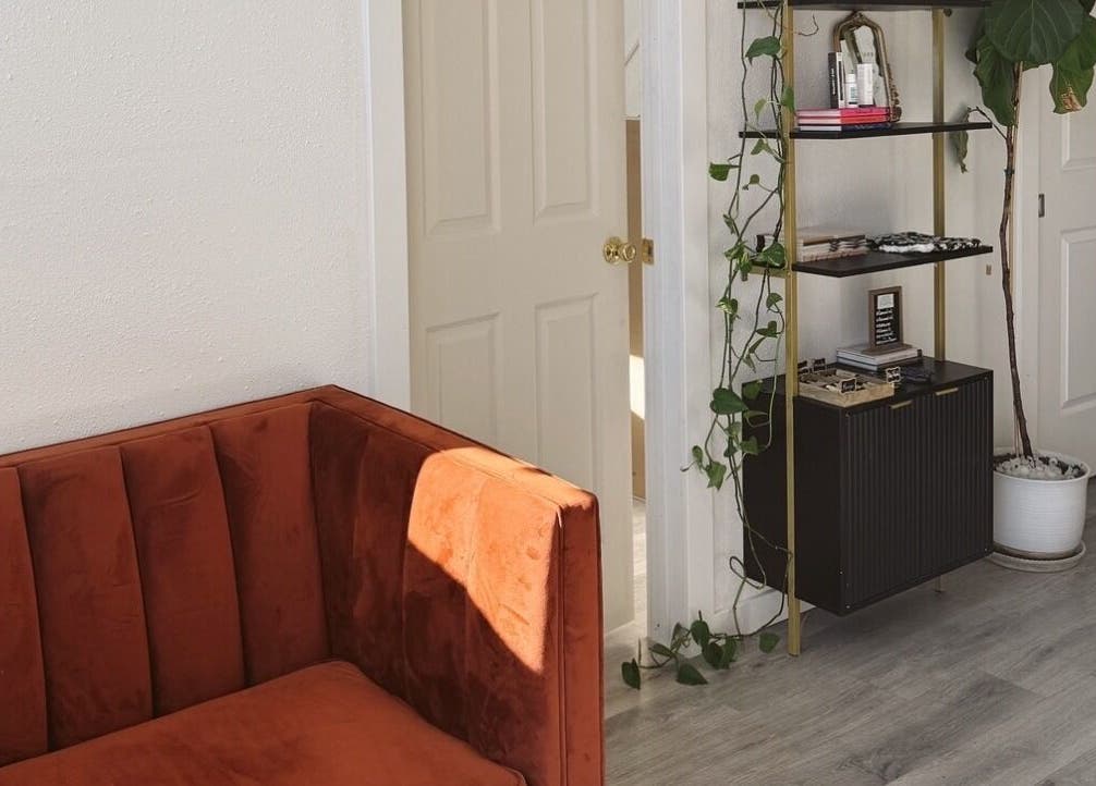 Cozy seating and decor inside Clawed and Polished, Redlands, California, US, showcasing a warm vintage style.