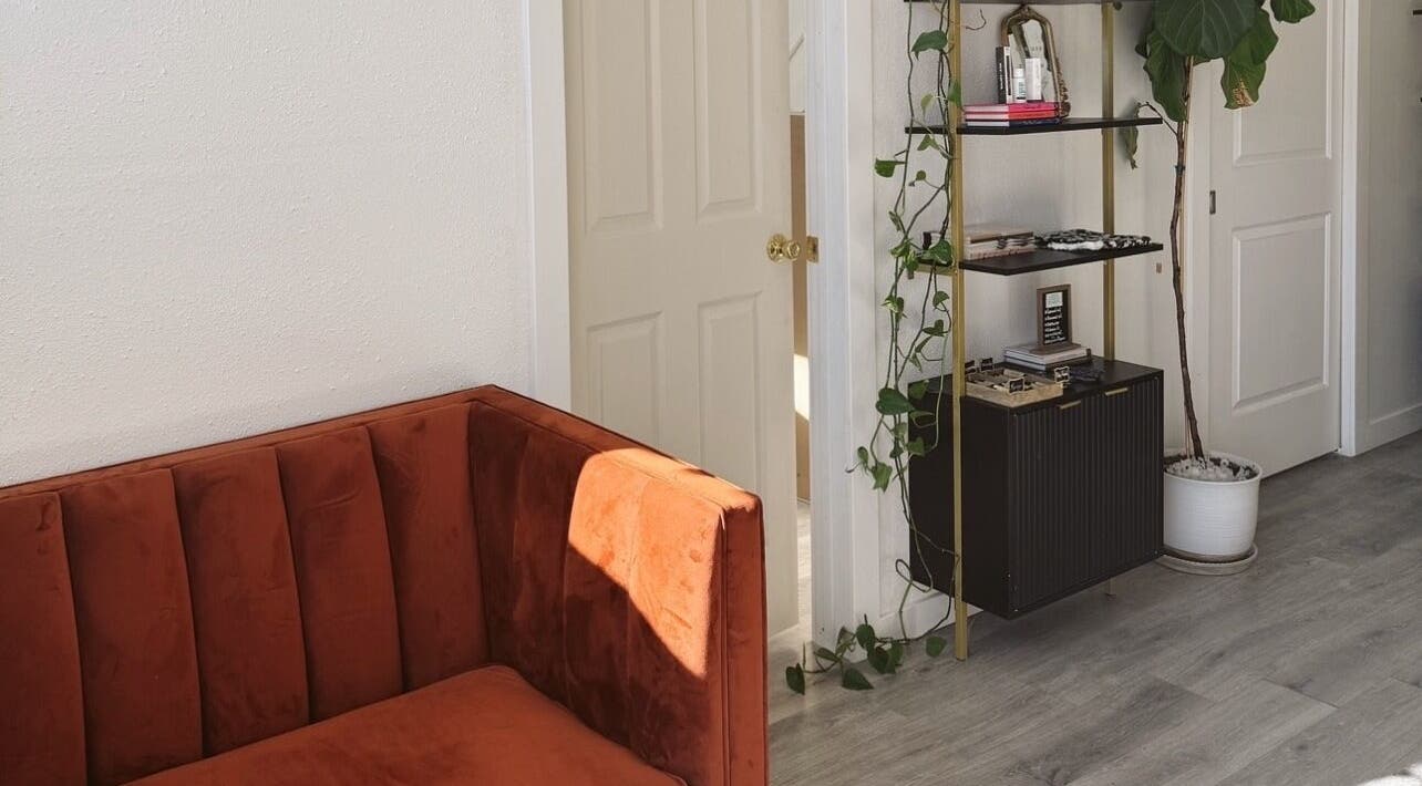 Cozy seating and decor inside Clawed and Polished, Redlands, California, US, showcasing a warm vintage style.