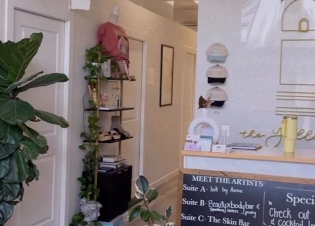 Stylish interior of Clawed and Polished, Redlands, California, US, featuring lush plants and decor.