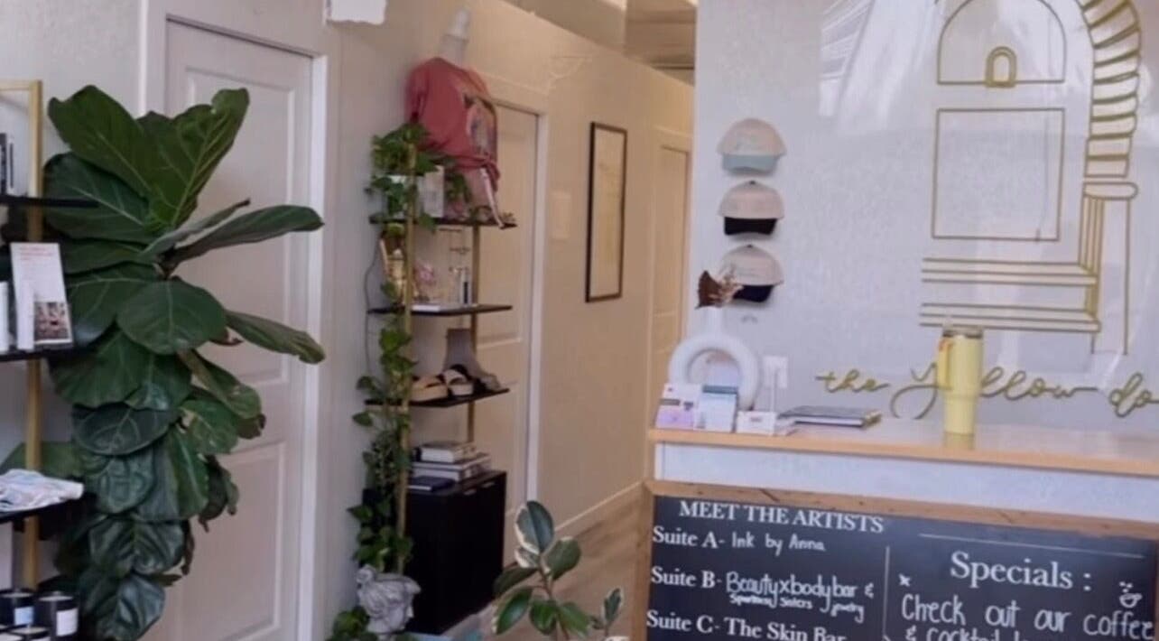 Stylish interior of Clawed and Polished, Redlands, California, US, featuring lush plants and decor.