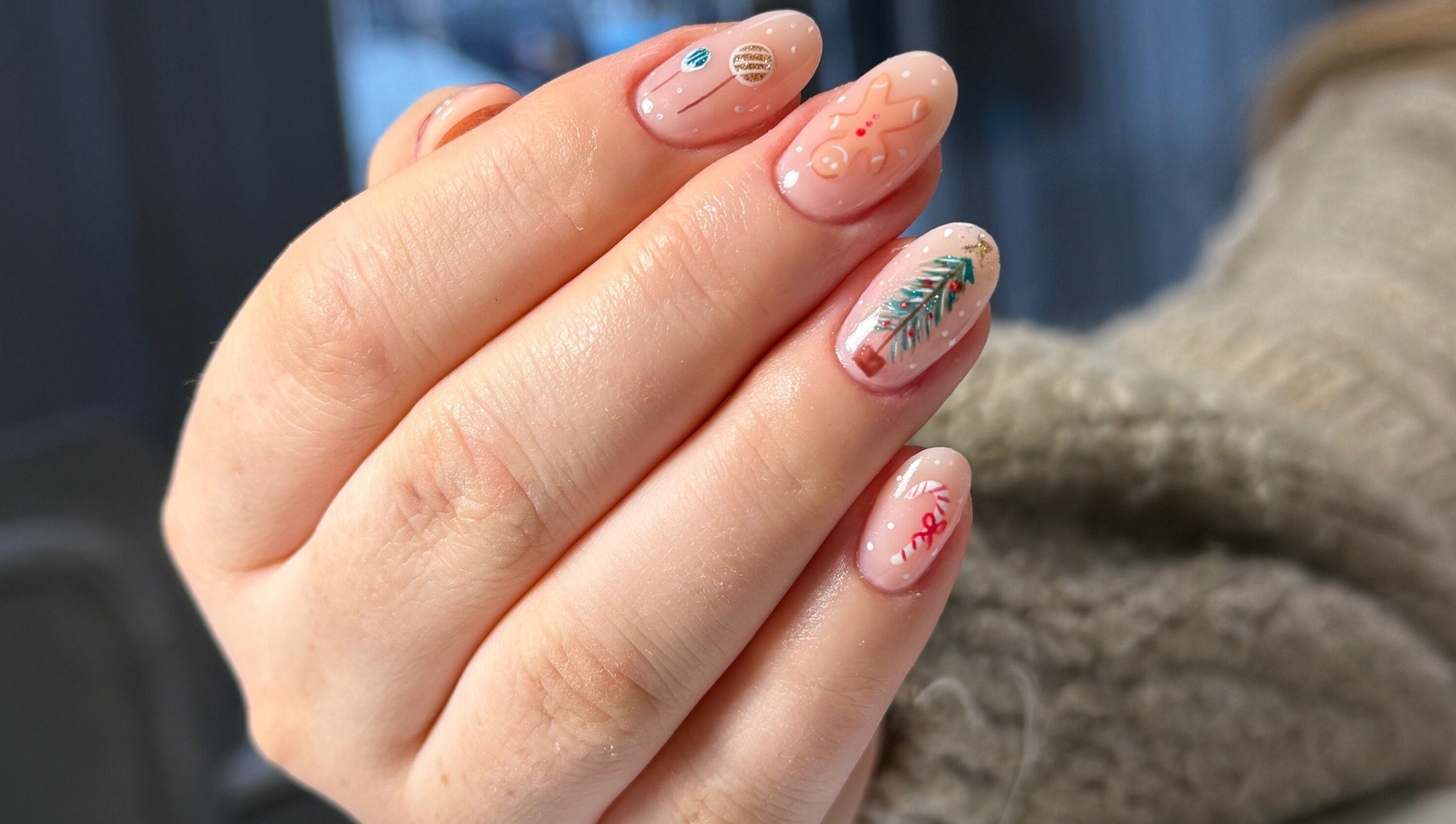 Nail art with festive designs from Nails By Somy in Bredbury, England, GB, showcasing intricate holiday details.