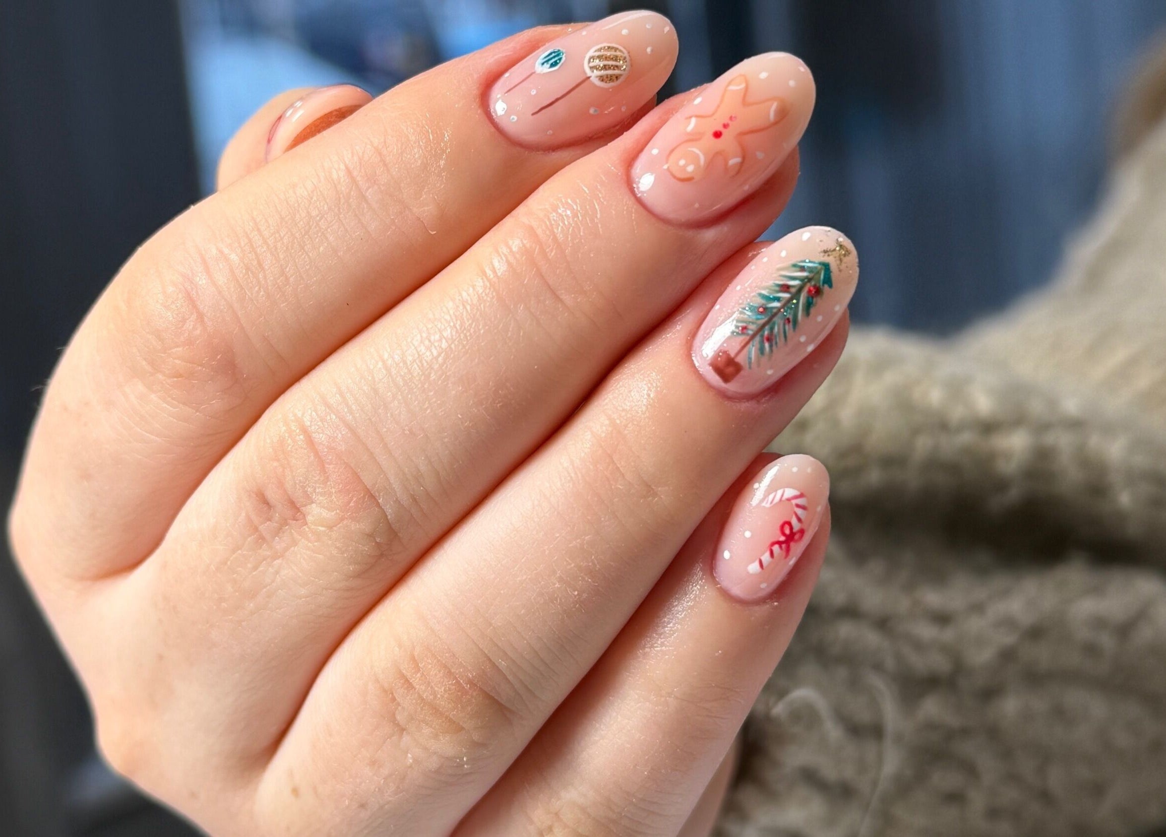 Nail art with festive designs from Nails By Somy in Bredbury, England, GB, showcasing intricate holiday details.