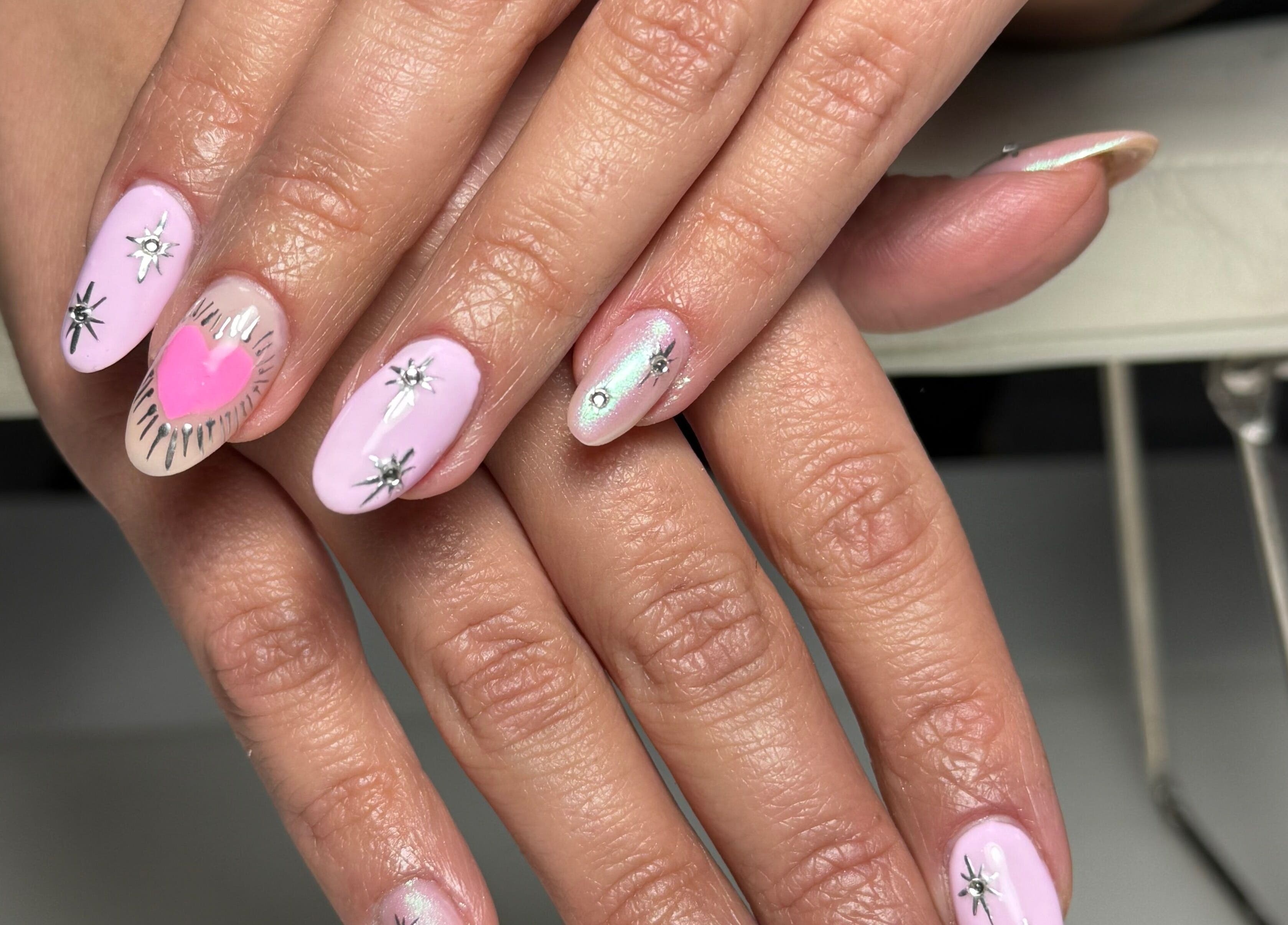 Elegant pink and silver nail art at Nails By Somy in Bredbury, England, GB, showcasing intricate designs.