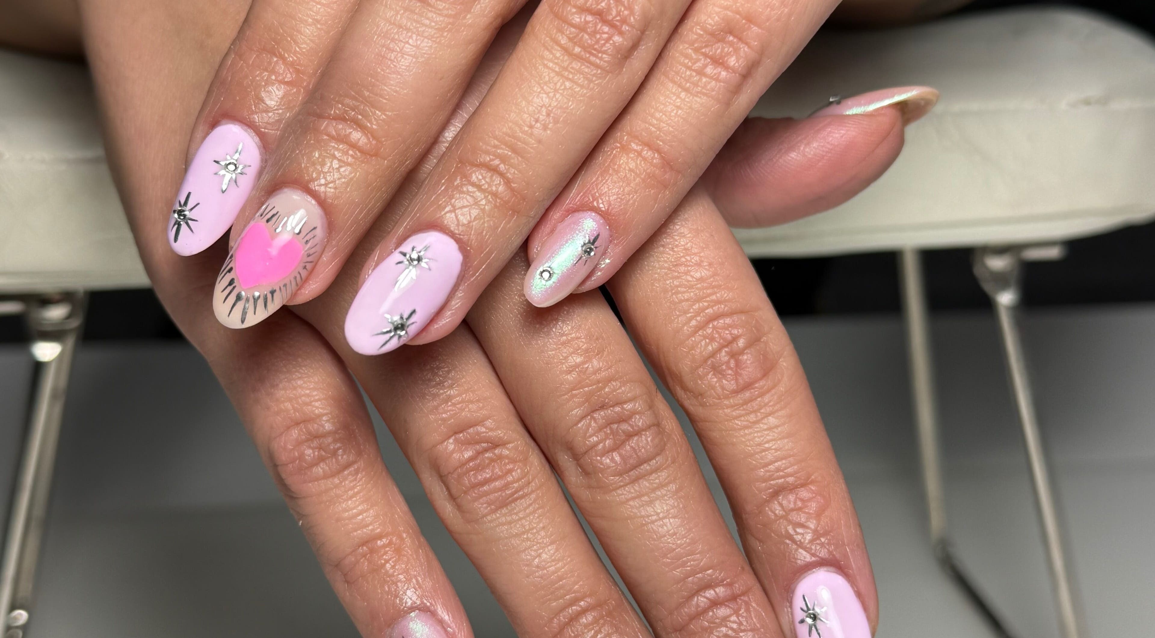 Elegant pink and silver nail art at Nails By Somy in Bredbury, England, GB, showcasing intricate designs.