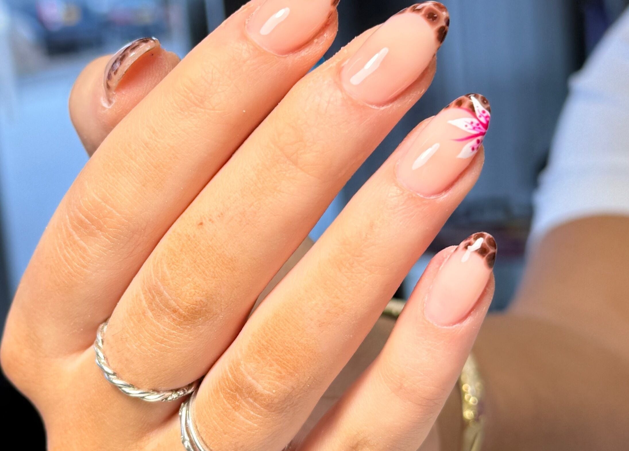 Stylish manicure with floral design at Nails By Somy in Bredbury, England, GB.