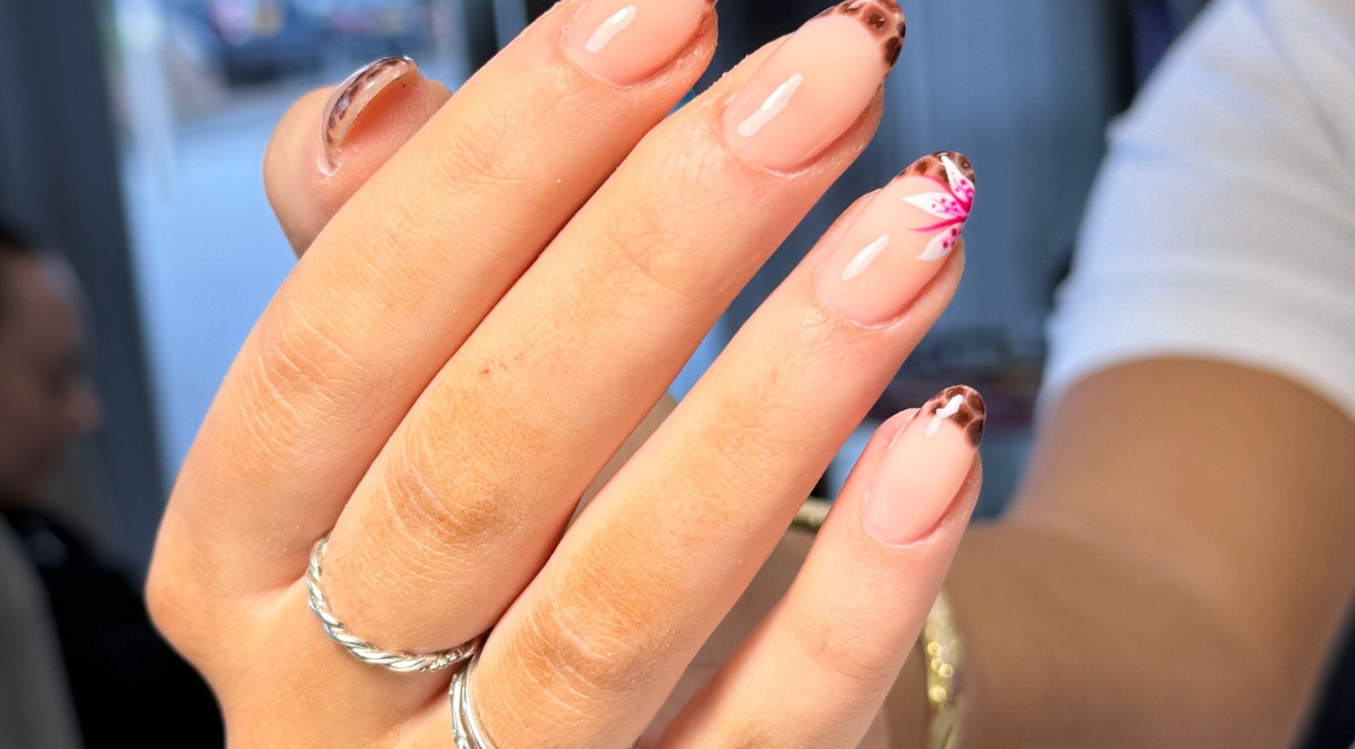 Stylish manicure with floral design at Nails By Somy in Bredbury, England, GB.