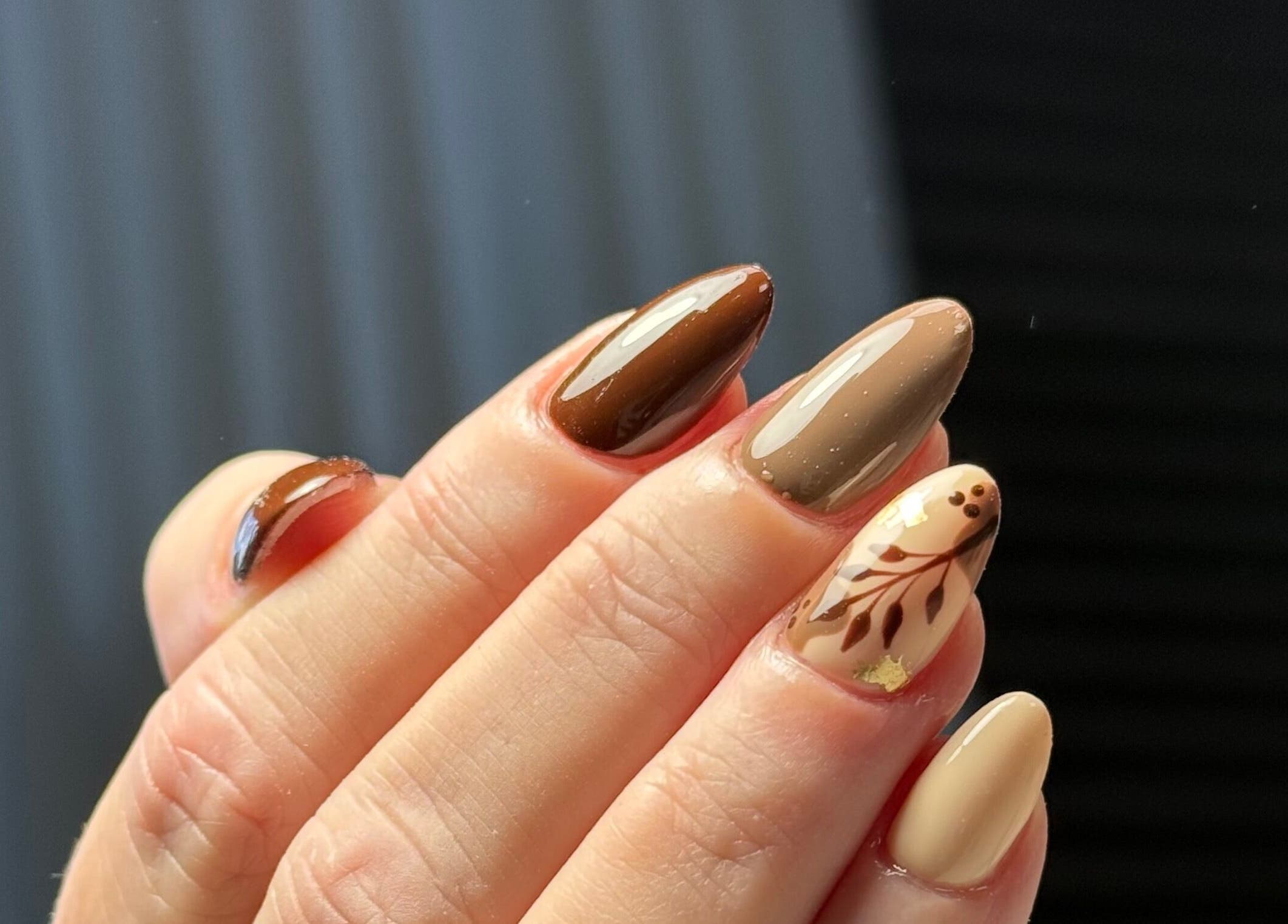 Stylish autumn-themed nails at Nails By Somy, Bredbury, England, GB with brown and beige designs.