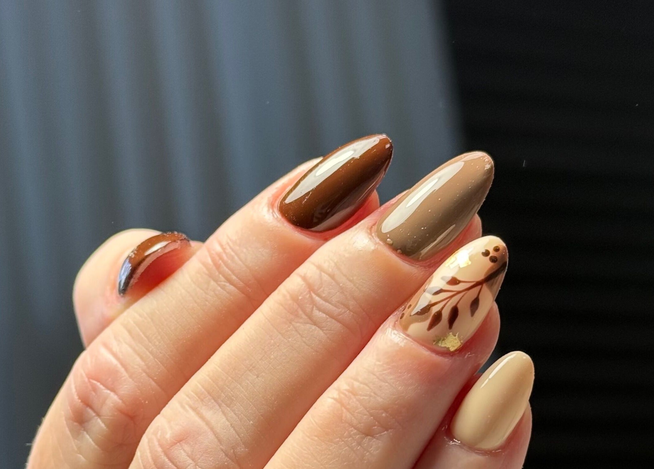 Stylish autumn-themed nails at Nails By Somy, Bredbury, England, GB with brown and beige designs.