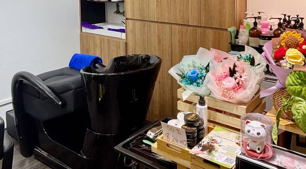 Cozy salon corner at Angel Garden Studio, Singapore, SG with floral bouquets and stylish wash station.