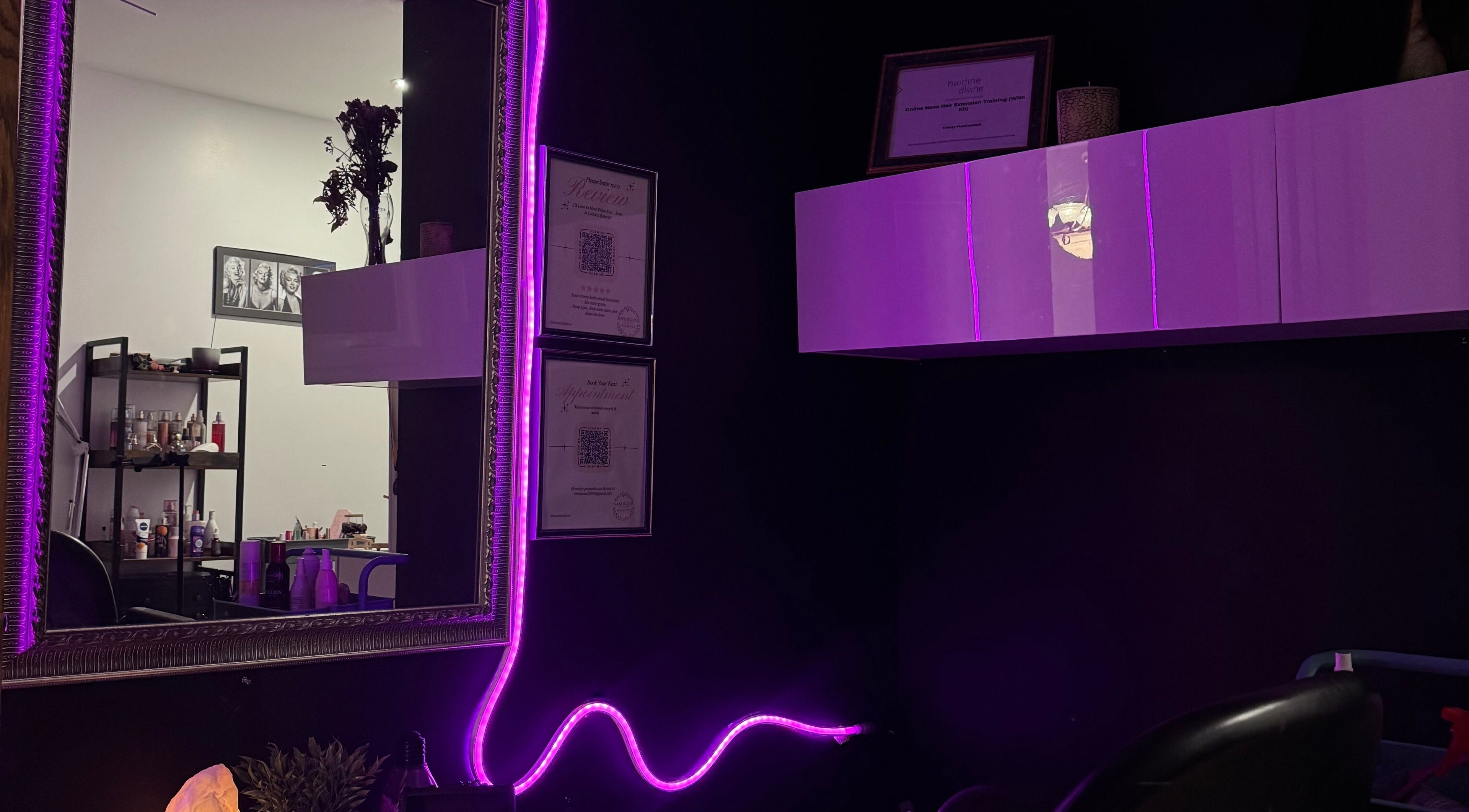 Stylish interior of NanoGlow Hair Co. in Fort Erie, Ontario, CA with purple lights and decor.
