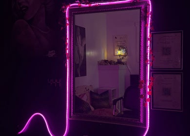 Vibrant neon mirror decor at NanoGlow Hair Co., Fort Erie, Ontario, CA showcasing stylish illumination.