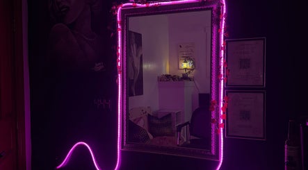 Vibrant neon mirror decor at NanoGlow Hair Co., Fort Erie, Ontario, CA showcasing stylish illumination.