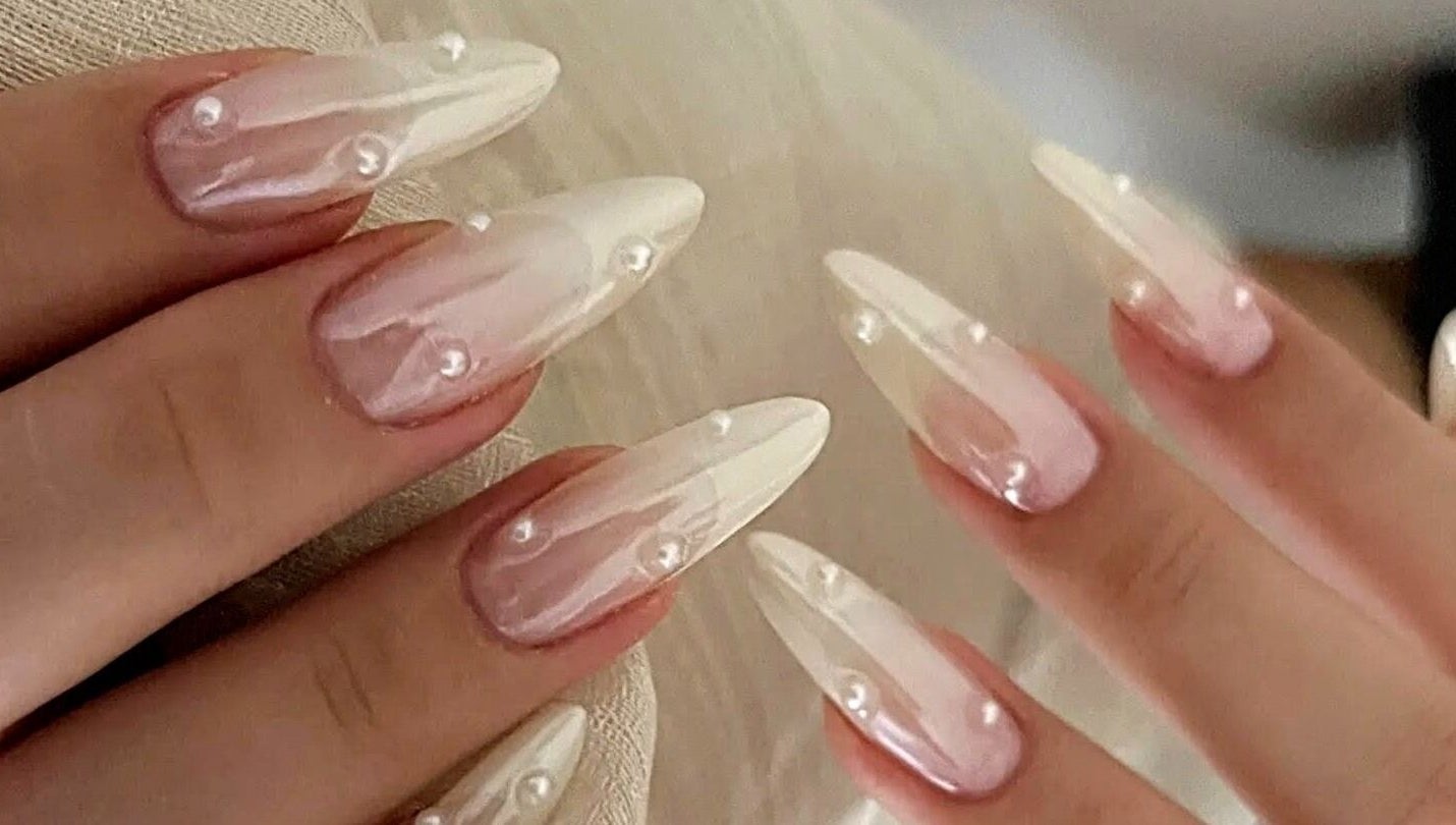 Elegant pearl-adorned nails at Secret Butterfly Nails and Beauty, Sydney, New South Wales, AU.