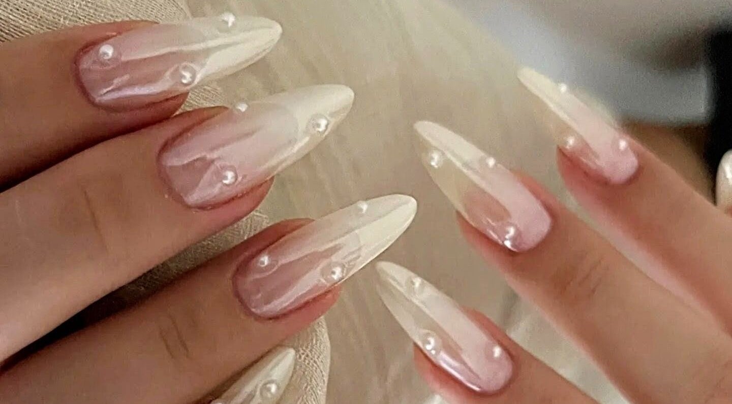 Elegant pearl-adorned nails at Secret Butterfly Nails and Beauty, Sydney, New South Wales, AU.