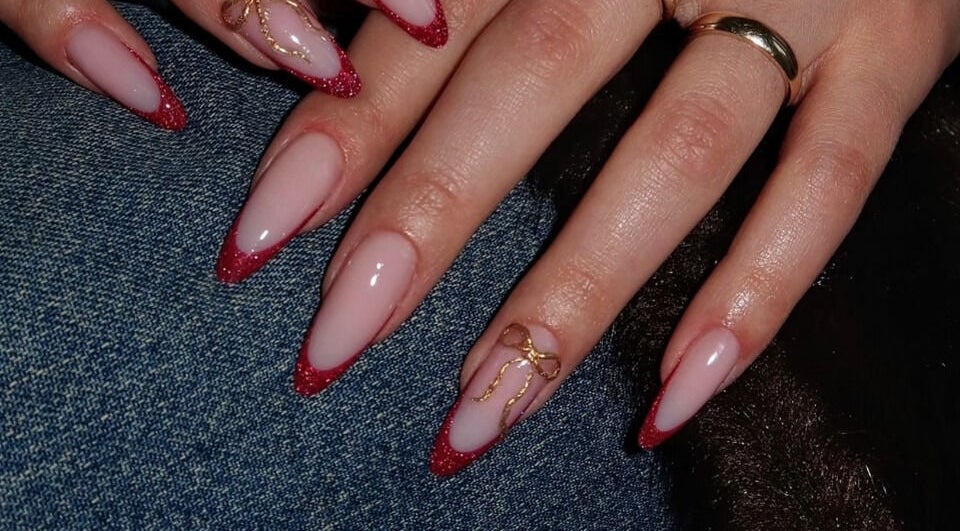 Elegant nails with red glitter tips from Secret Butterfly Nails and Beauty, Sydney, New South Wales, AU.