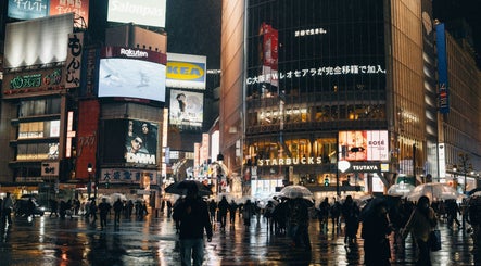 Bustling night city scene with advertisements near KDC, Dasmariñas, Calabarzon, PH.