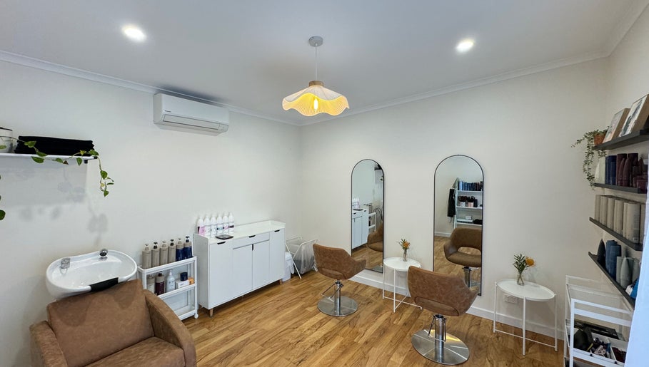 Elegant interior of H&B by Mikayla in Coromandel East, South Australia, AU with stylish chairs and mirrors.