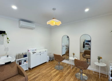 Elegant interior of H&B by Mikayla in Coromandel East, South Australia, AU with stylish chairs and mirrors.