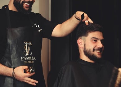 Barber giving a stylish haircut at Familia Es Todo in Amman, Amman Governorate, JO.
