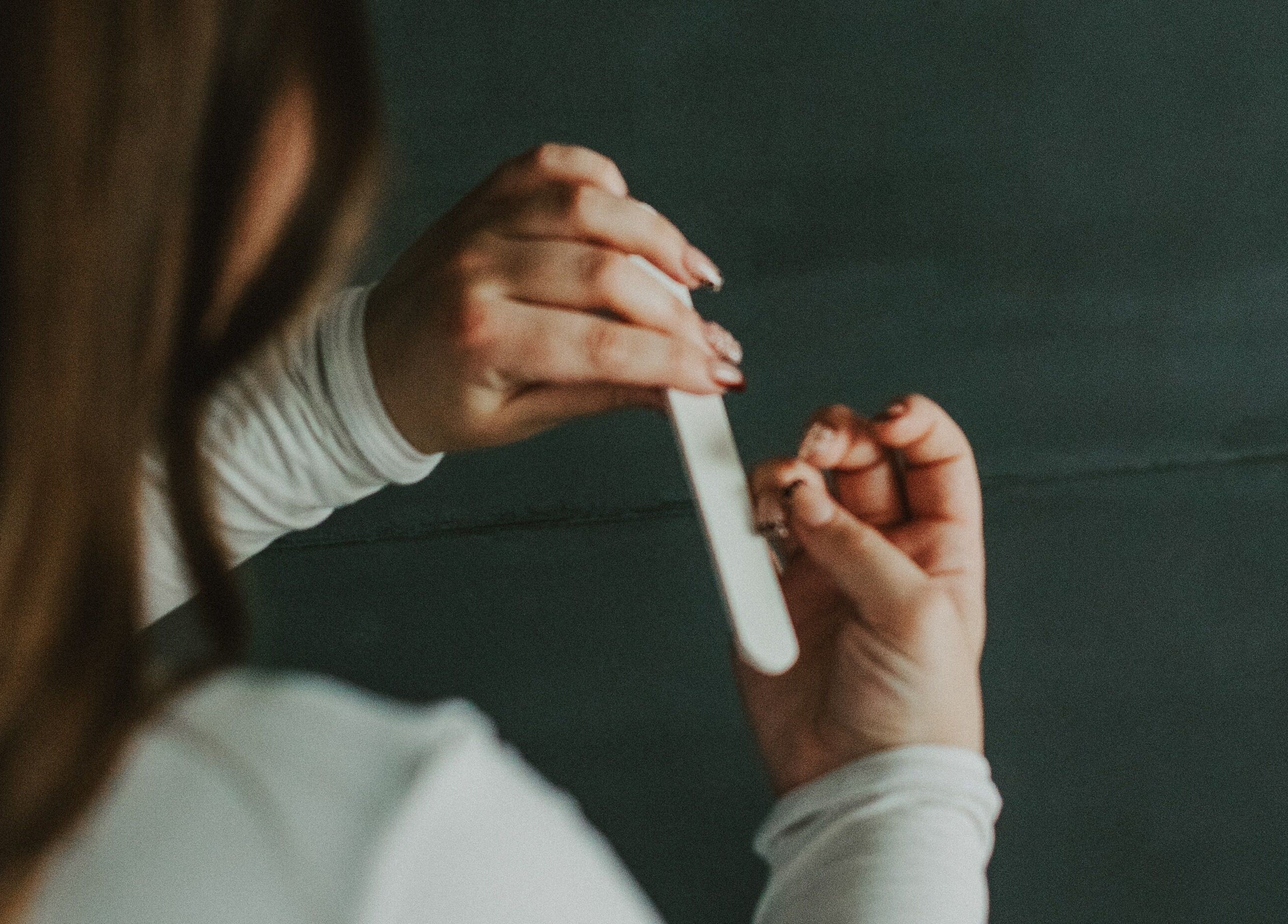 Nail filing service at Nails by cj, Spruce Grove, Alberta, CA, showcasing professional care.