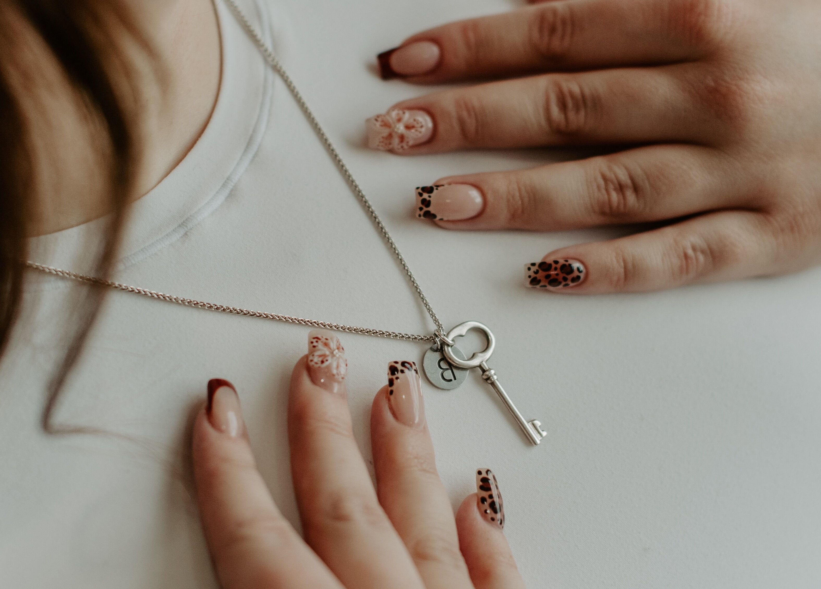 Elegant nail designs with key necklace at Nails by cj, Spruce Grove, Alberta, CA.