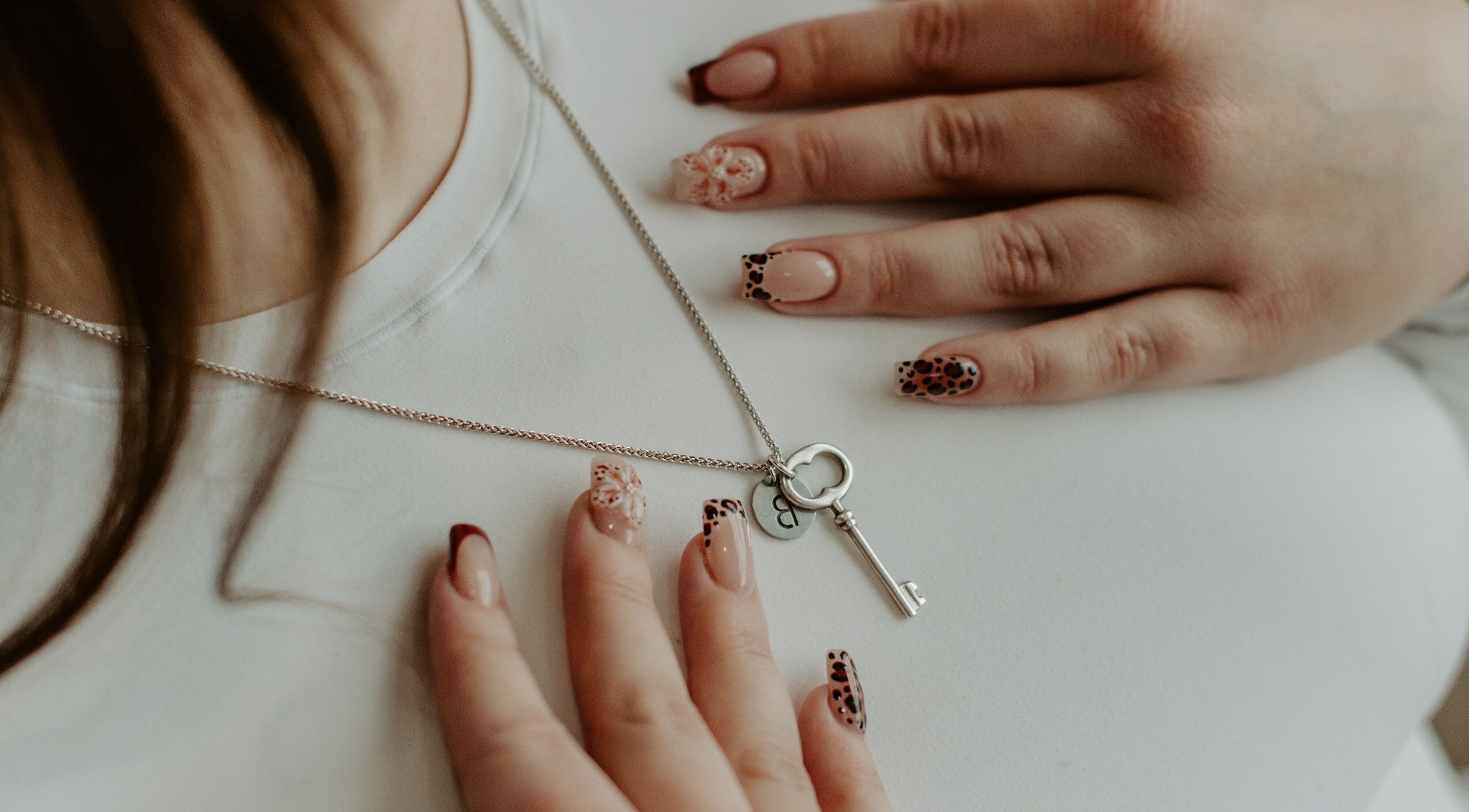 Elegant nail designs with key necklace at Nails by cj, Spruce Grove, Alberta, CA.