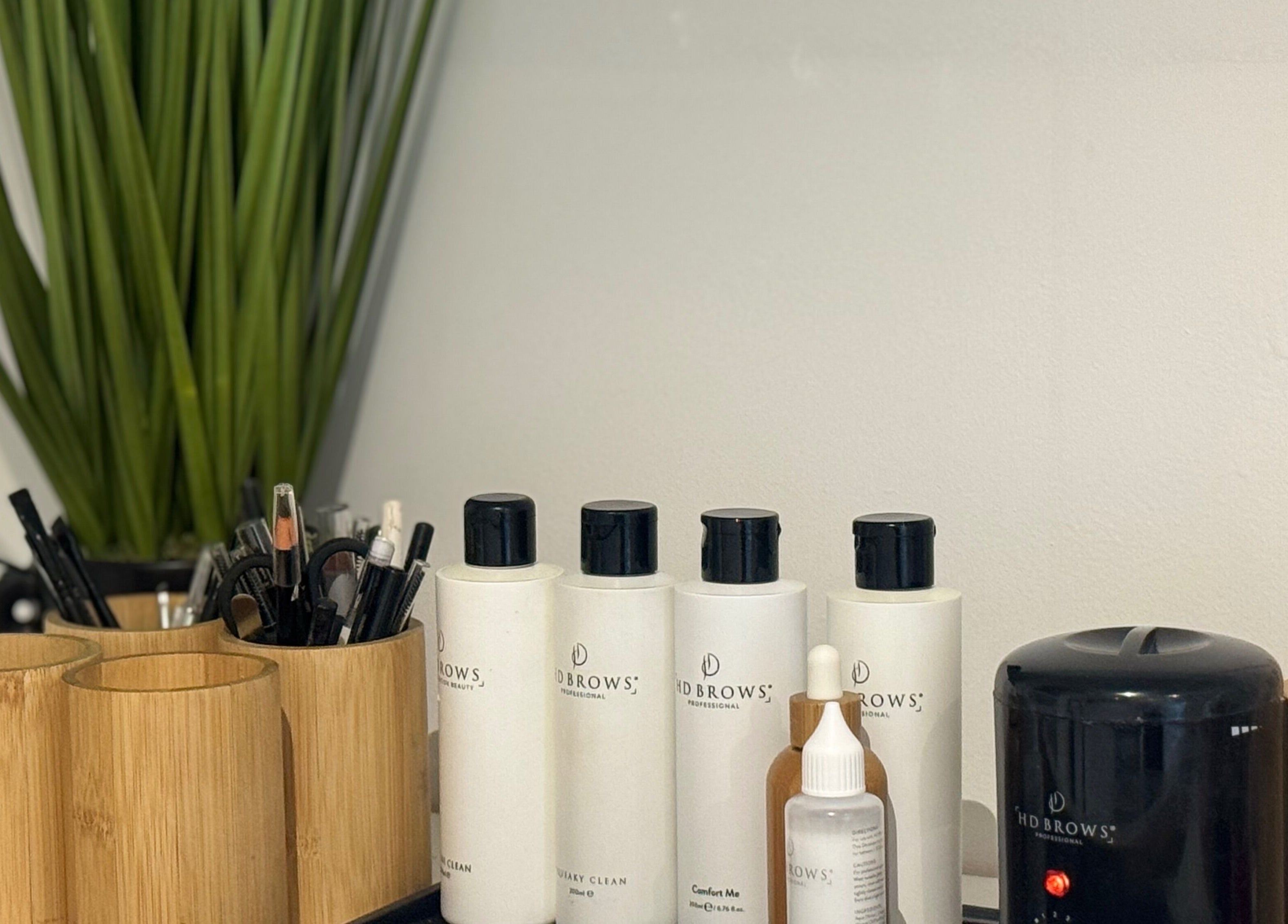 Beauty products and tools at Muse Beauty + Wellness in Weymouth, England, GB for a relaxing experience.