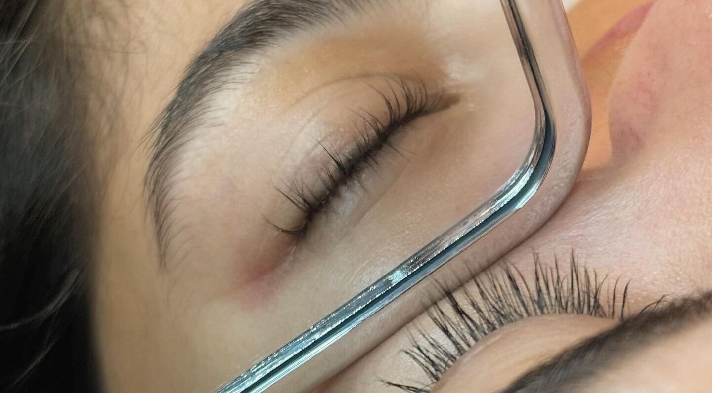 Close-up of eyelash application at K.Banks Esthetics, Delaware, Ohio, US, showcasing expert precision.