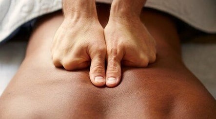 Close-up of relaxing massage at Stephanie Hunter, Hamilton, Waikato, NZ, focusing on hands applying pressure.