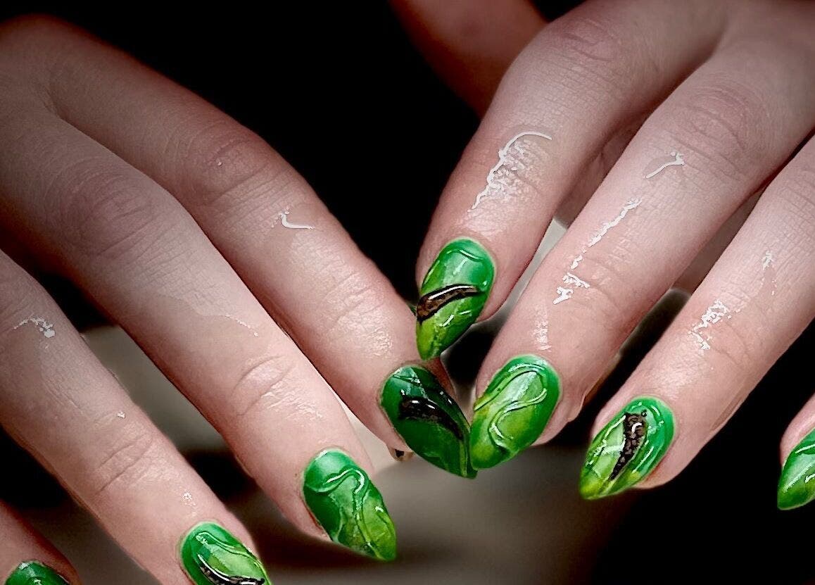 Green nail art design at Milkshake Nails & Tan, Waitara, Taranaki, NZ, showcasing verdant intricate patterns.