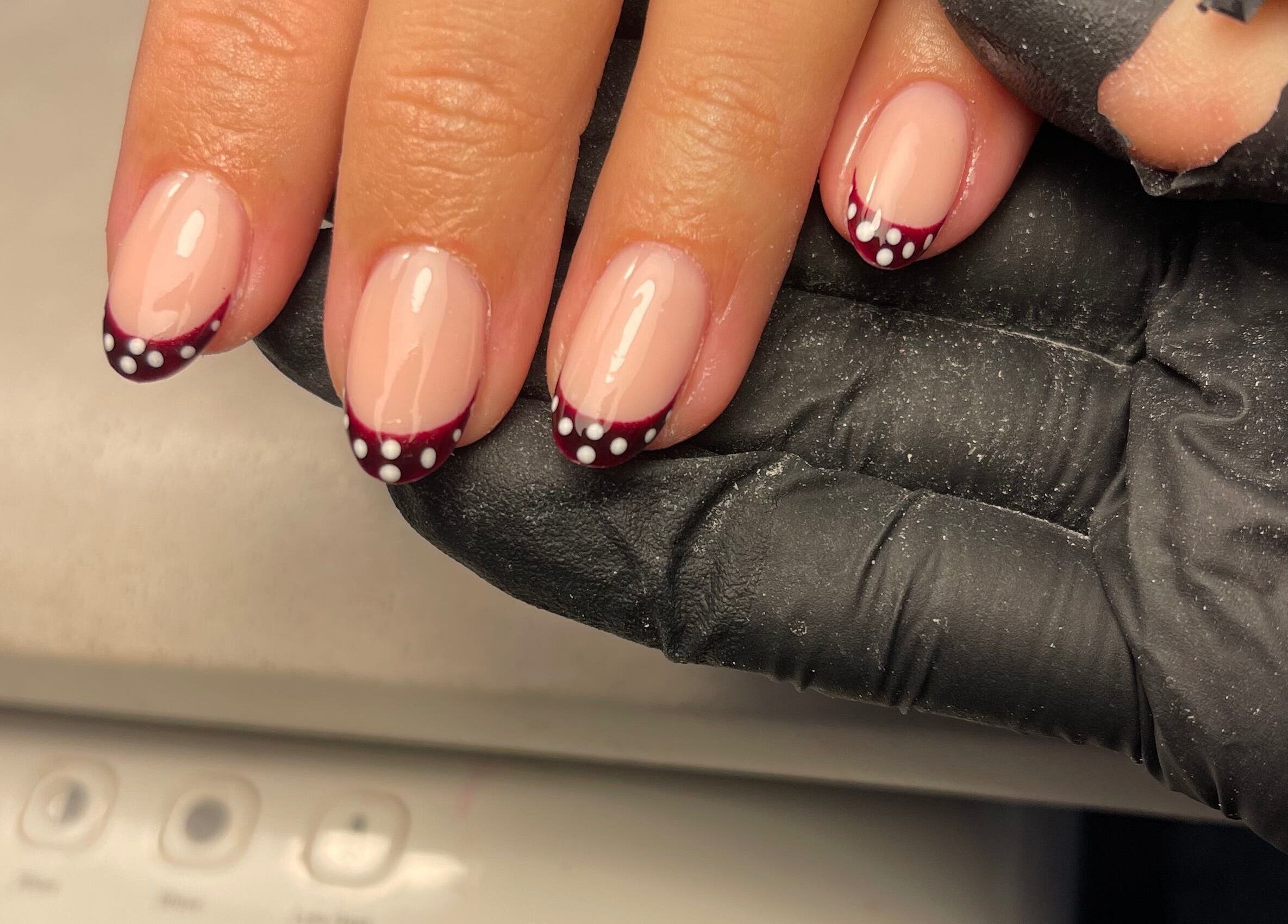 Stylish maroon and dot nail art at Ella Elyse Beauty - Wilmslow, Wilmslow, England, GB.