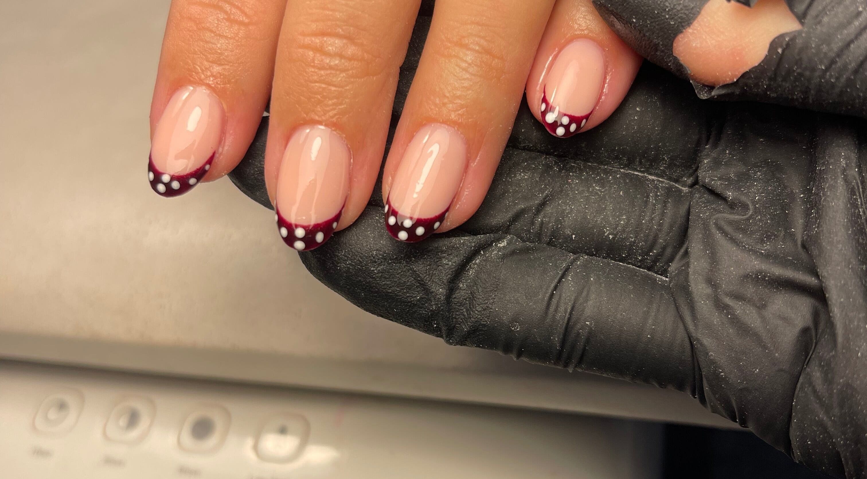 Stylish maroon and dot nail art at Ella Elyse Beauty - Wilmslow, Wilmslow, England, GB.