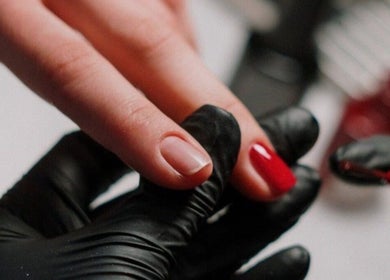 Nail artist painting nails red at Beauty In My Hair, Riyadh, Riyadh Province, SA.