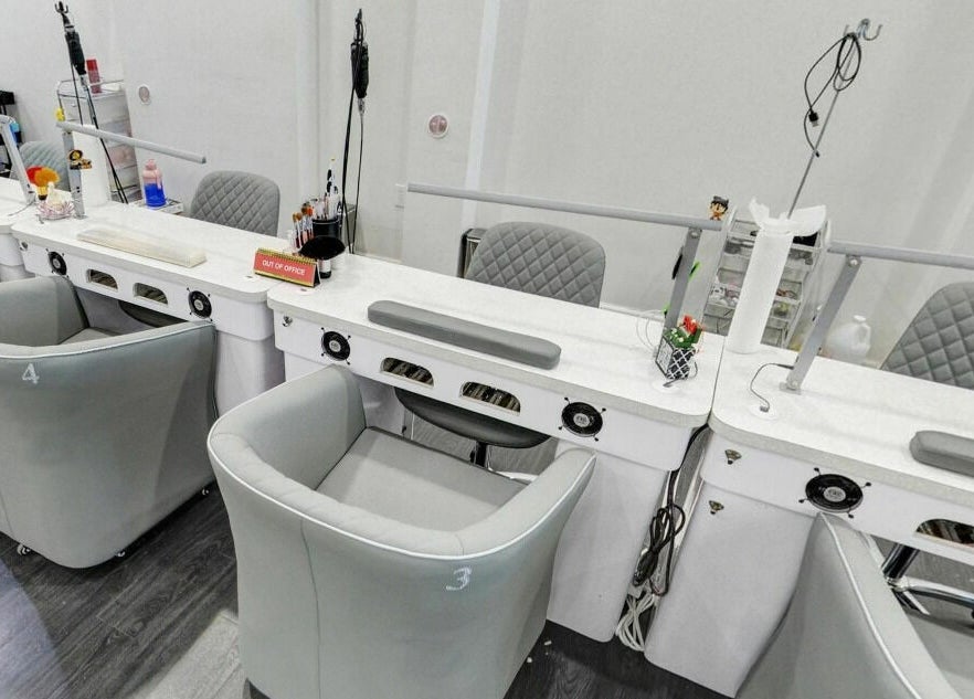 Modern nail stations at Teresa's Beauty Bar in Colonial Heights, Virginia, US, offering elegant services.