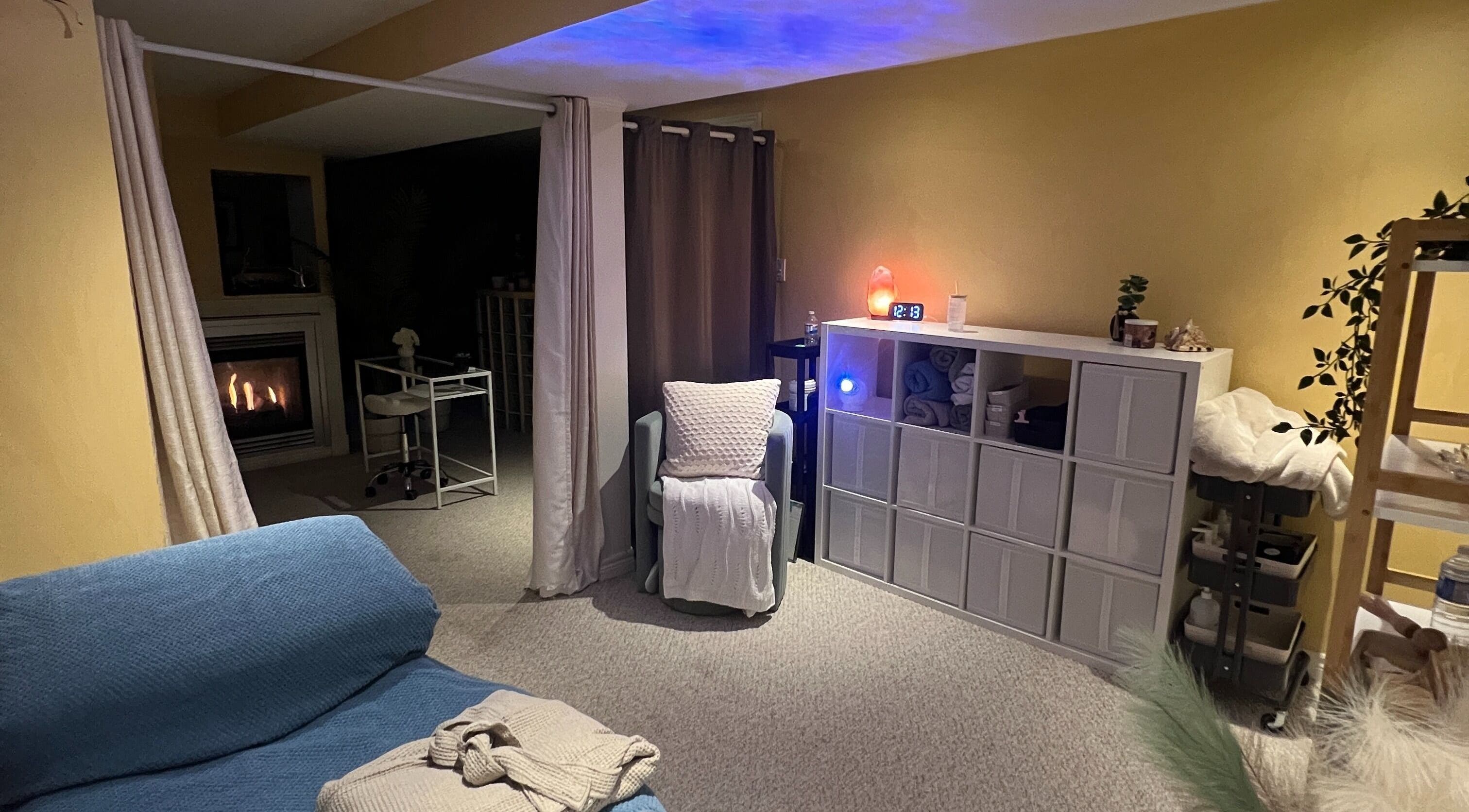 Warm treatment room at Diamond Kollective Aesthetics, Vaughan, Ontario, CA with elegant decor and fireplace.