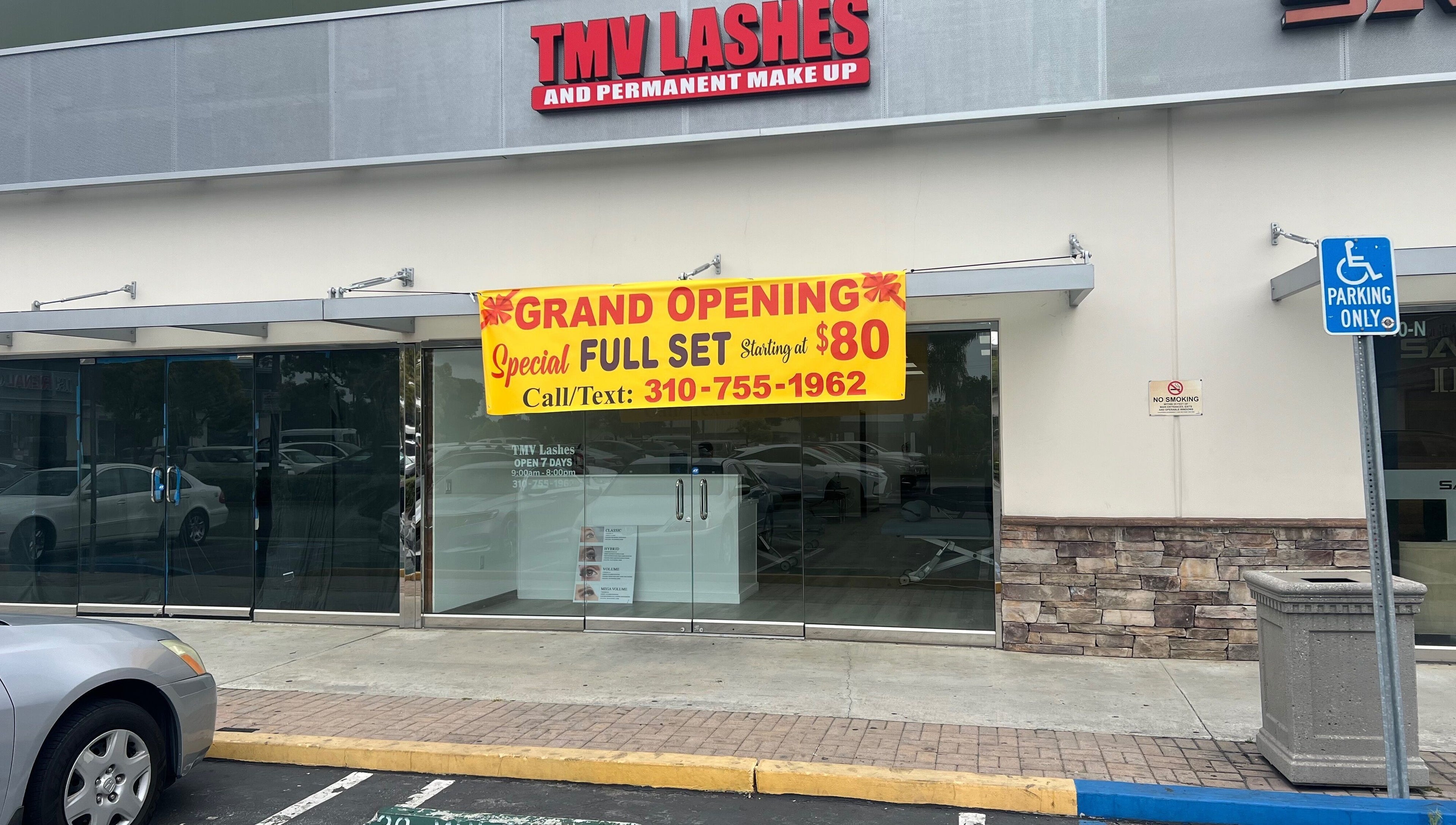 Tmv Lashes storefront in Carson, California, US, with grand opening banner for lash services.