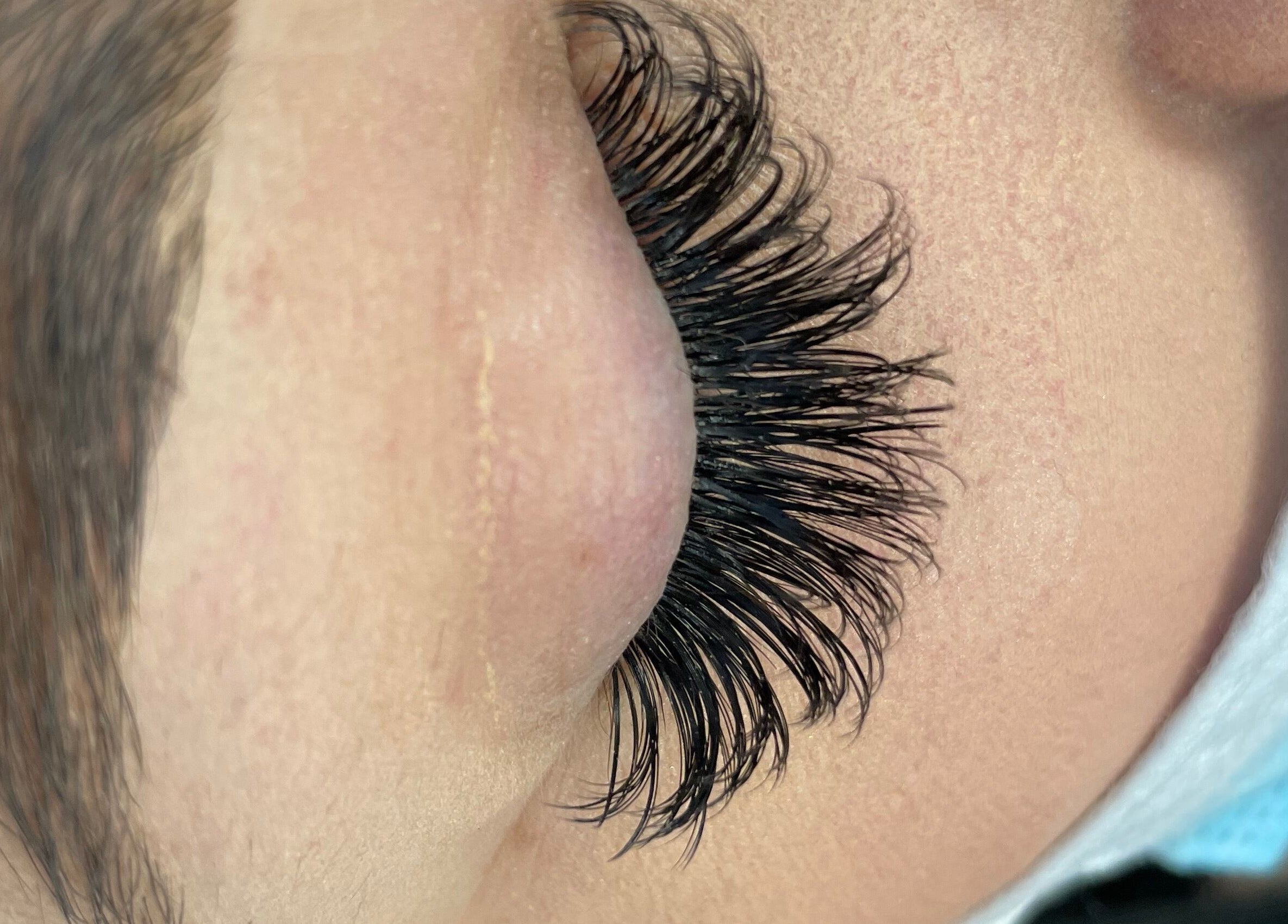 Closeup of expertly applied lashes at Tmv Lashes, Carson, California, US.