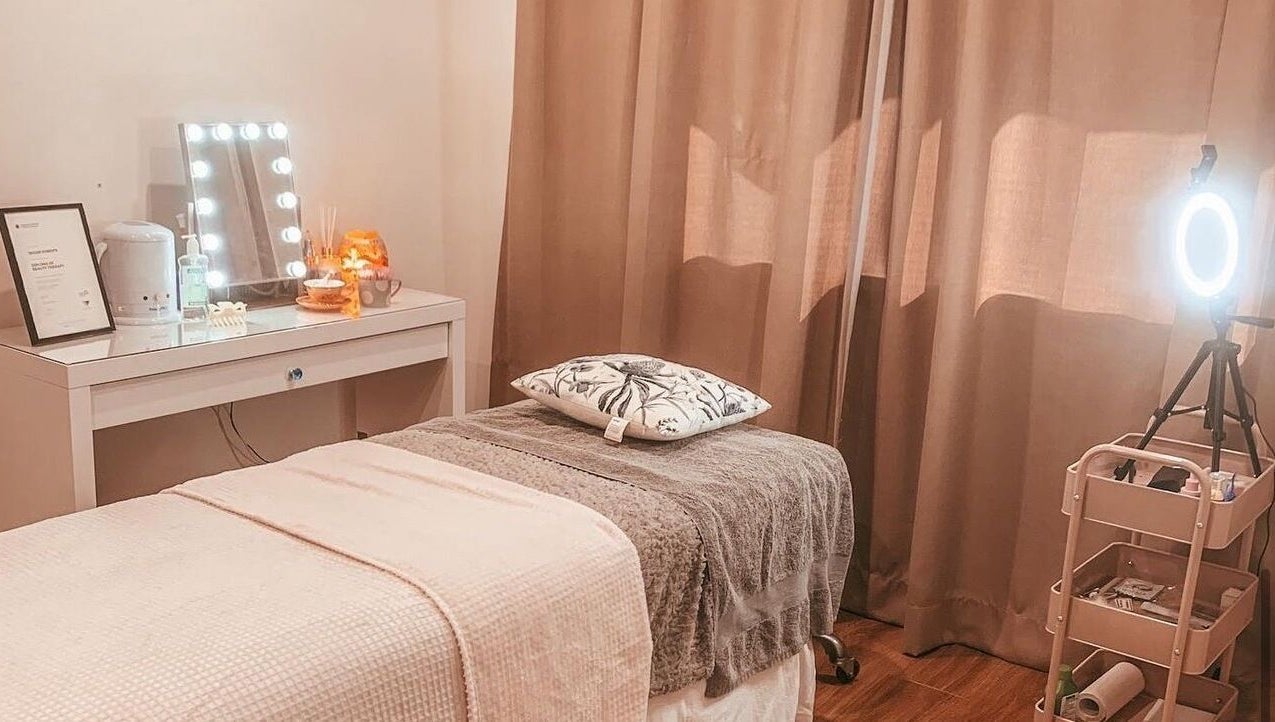 Calming therapy room at Lash’D Out Beauty & Brows, Fortitude Valley, Queensland, AU with cozy bed and vanity setup.
