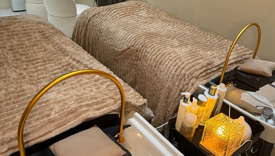 A cozy treatment area at Head Space Manchester featuring plush beds and beauty products. Located in Manchester, England, GB.